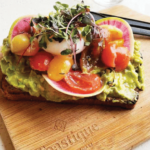 toastique healthy franchises toast on wooden chopping board